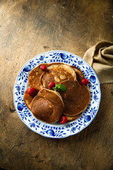 Traditional homemade pancakes with raspberry