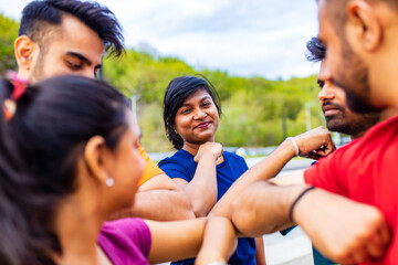 Fototapeta premium four indian people warming up outdoors in sport wear morning time urban