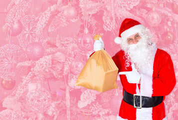 Santa Claus with a gift bag, gifts and wishes for children on Christmas and New Year's Eve, isolated by a pink abstract background