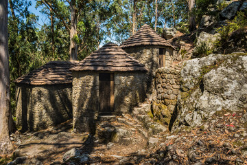 Walls in stone and typical construction of bronze age houses in Saint Lawrence Castro, Vila Chã...