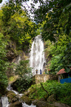 Batumi, Georgia – September, 2021: Makhuntseti waterfall, one of the highest waterfalls in Ajara. Point in a Acharistsqali river, where water flows over a vertical drop or a series of steep drops © IvanSemenovych