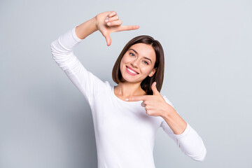 Fototapeta premium Photo of pretty bob hairdo millennial lady take photo wear white shirt isolated on grey color background