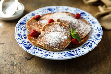 Traditional homemade pancakes with raspberry