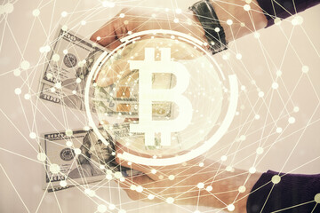 Multi exposure of blockchain theme drawing hologram and USA dollars bills and man hands. Business concept.