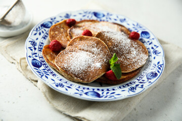Traditional homemade pancakes with raspberry