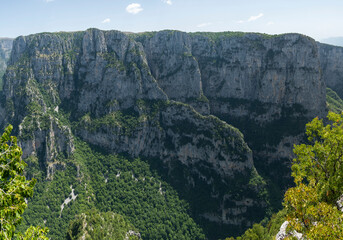Fototapeta na wymiar Daytime view of Vikos Gorge from the Oxya Viewpoint in the park national of Vikos-Aoos in northern Greece