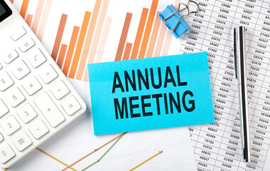 Obraz premium ANNUAL MEETING text on the sticker on diagram background