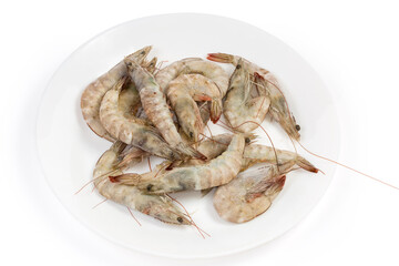 Frozen king prawns on dish on white background close-up