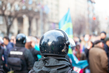 Riot police on duty during crowd protest or demonstration