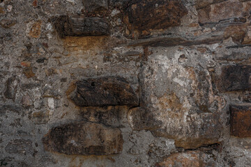 Mystic grim mountain rock prison. Fogy spooky fortress in dark alley. Old cragged creepy mythical cliff. Vintage fearful crannied horrible stone. Damaged terrible karst cavern for crime mystery drama