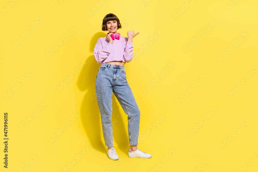 Canvas Prints Full length body size view of lovely cheerful girl listening melody showing copy space ad isolated over bright yellow color background