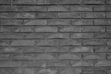 Old, bright, reliable and strong dark grey brick wall texture.
