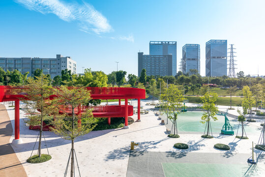 An outdoor park with a red bridge in Shenzhen, China