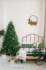 Christmas bedroom interior in green and white colors. A cozy home moment. Happy New Year Concept