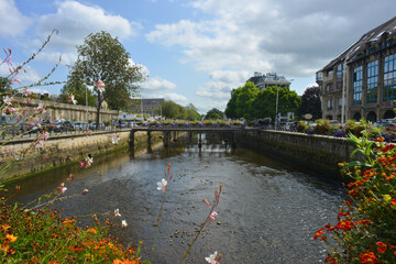 Quimper, France, beautiful view over the river Odet bridges with flowers