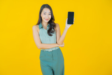 Portrait beautiful young asian woman smile with smart mobile phone