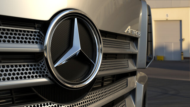 Mercedes logo on a truck, close-up view. Mercedes-Benz Actros