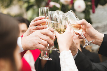 Bride and a groom with the glasses of champagne