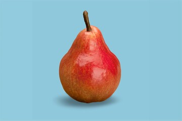 Pear on a background as a female body shape. A metaphor of sex, sexuality, vagina on the desk
