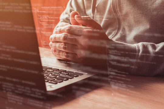 Software compiling on laptop computer, software developer and programer complies code at office