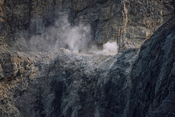 picture of mining in a quarry with demolition equipment, industrial photography, mining and environmental destruction