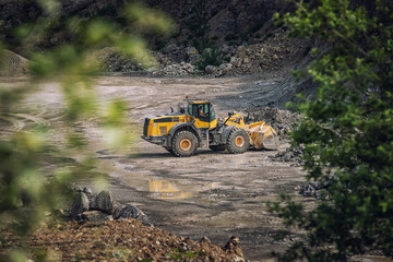 picture of mining in a quarry with demolition equipment, industrial photography, mining and...