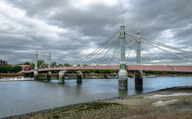 Fototapeta na wymiar Albert Bridge, a road bridge over the Tideway of the River Thames connecting Chelsea to Battersea in London, UK.