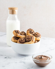 Mount of some chocolate palm with a bottle of milk and nutella or chocolate cream