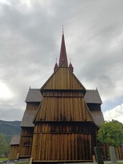  side plan background of a dark wood stavkirke in norway