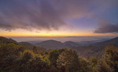Aerial view of sunrise above fluffy sea fog misty clouds with mountain hill from Phu Tub Berk, Khao Kho, Phetchabun, Thailand with sunlight. Nature landscape background in sunset.