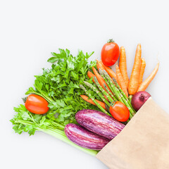 Fresh organic vegetables in craft shopping bag