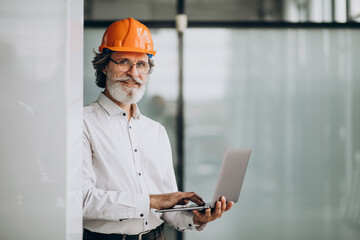 Middle aged business man in a hard hat
