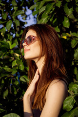 Fototapeta premium glamorous woman wearing sunglasses summer posing nature tropics