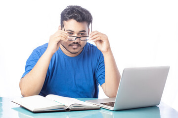 young business man wearing eyeglass while using computer