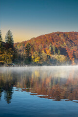 Fototapeta na wymiar autumn landscape with lake and mountains