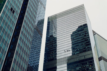 Obraz premium RUSSIA, MOSCOW: Bottom up scenic cityscape view of industrial glass skyscrapers 
