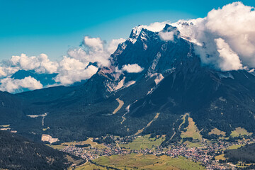 Beautiful alpine summer far view of the famous Zugspitze summit seen from the Grubigstein summit...