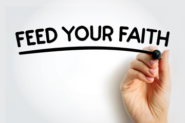 FEED YOUR FAITH underlined text with marker, concept background