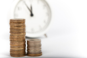 coins and alarm clock. money and economy concept. Isolated on white background.
