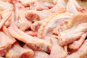 raw chicken  wings on white .