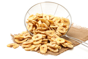 Banana chips on white background