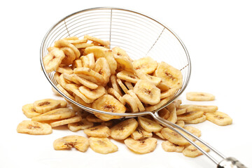 Banana chips on white background