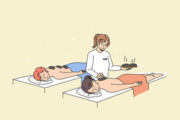 Calm couple relax have hot stone massage therapy in spa together. Happy man and woman rest enjoy body care procedures in saloon or aesthetic clinic. Beauty and cosmetology. Vector illustration. 