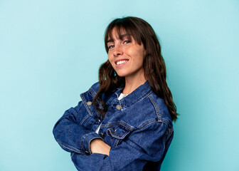 Fototapeta premium Young Argentinian woman isolated on blue background happy, smiling and cheerful.