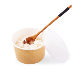 White long prepared rice in the ppper box for take out on white wooden background, top-view flat lay