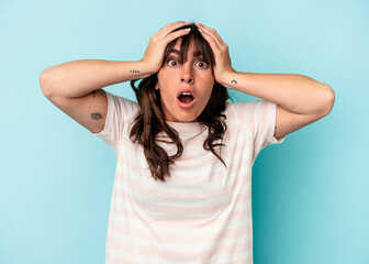 Fototapeta premium Young Argentinian woman isolated on blue background surprised and shocked.