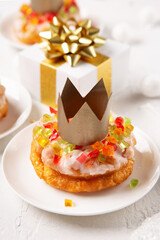Roscon de reyes, spanish three kings Christmas sweet cake with winter decorations on white background