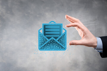 Businessman hand holding letter icon,email icons.Contact us by newsletter email and protect your...