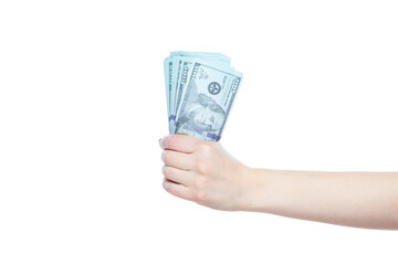 Close up of female hand holding dollar banknotes on white background. Concept of wealth, well being, success