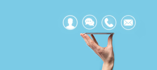 Businessman hand holding,pressing on icon phone, mail, telephone,message,post and person,user. Customer service call center contact us concept.Banner,copy space.Contact Methods.